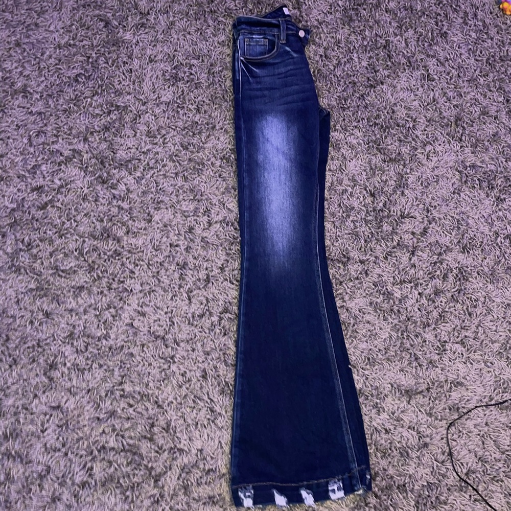 Signature High Rise Flare Stretch Jean
KANCAN. Blue jean color.